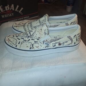 Vans White and Black Graphic Slip-On Sneakers